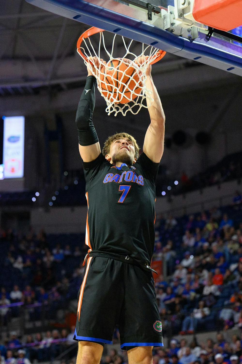 Florida guard Urban Klavzar (7) dunks during the second half of an NCAA college basketball game against Saint Francis, Wednesday, Dec. 17, 2025, in Gainesville, Fla.