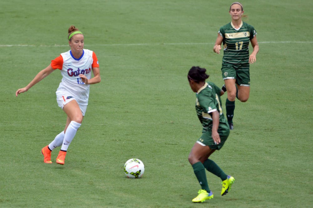 <p>Annie Speese (13) dribbles the ball down the field during Florida's 2-0 win against South Florida on Sunday at Donald R. Dizney Stadium. Speese scored both of UF's goals.</p>
