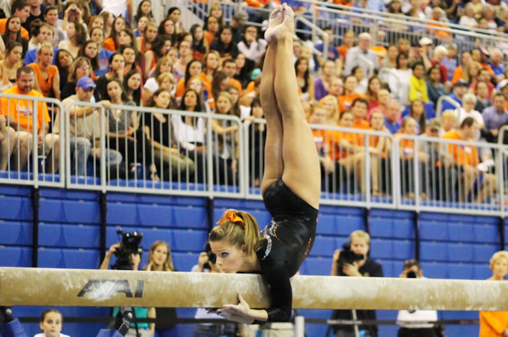 <p class="p1"><span class="s1">Gymnast Mackenzie Caquatto performs her beam routine during Florida’s 196.975-196.075 win against Kentucky on Feb. 22 in the O’Connell Center.</span></p>