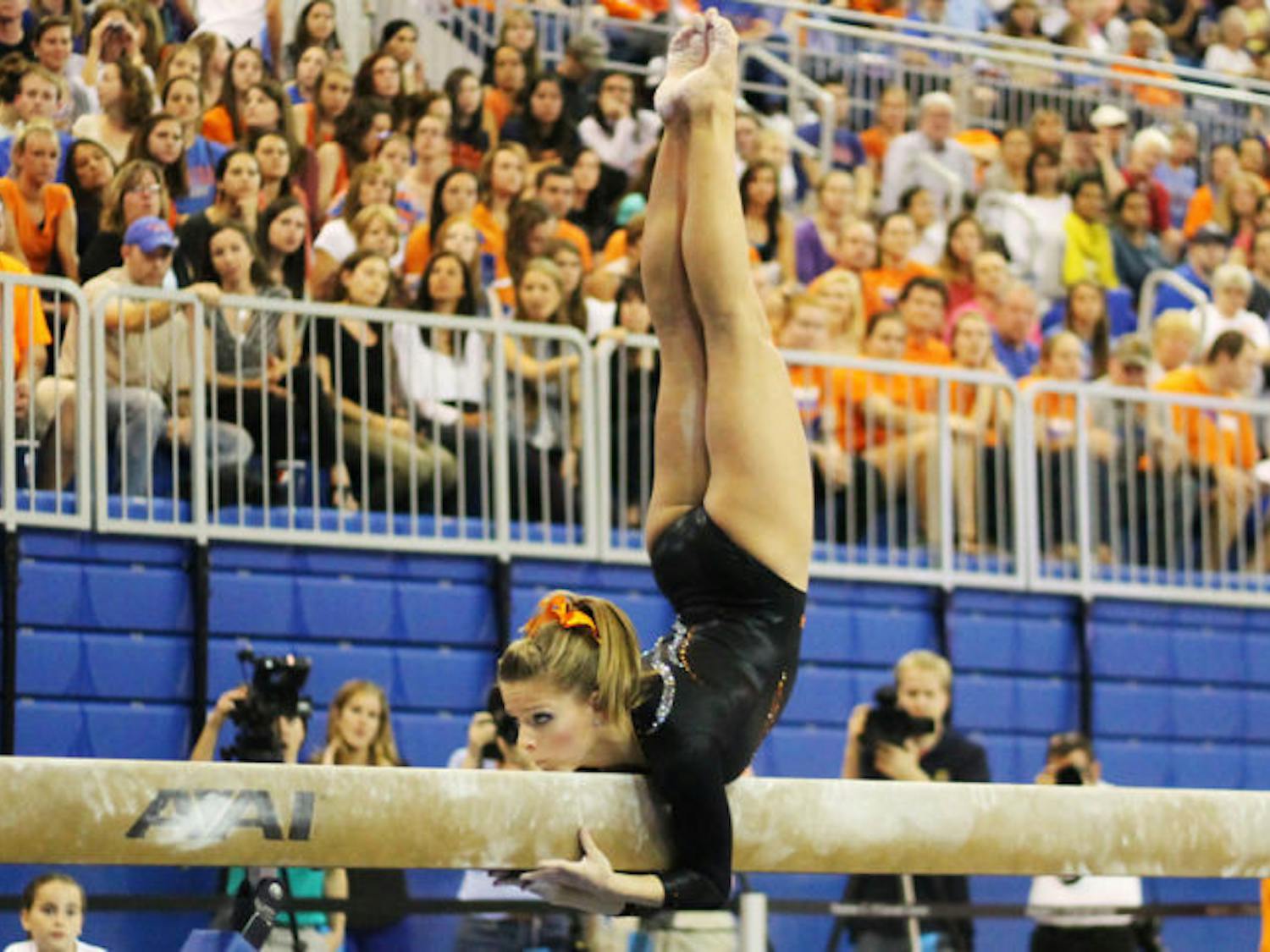 Gymnast Mackenzie Caquatto performs her beam routine during Florida’s 196.975-196.075 win against Kentucky on Feb. 22 in the O’Connell Center.