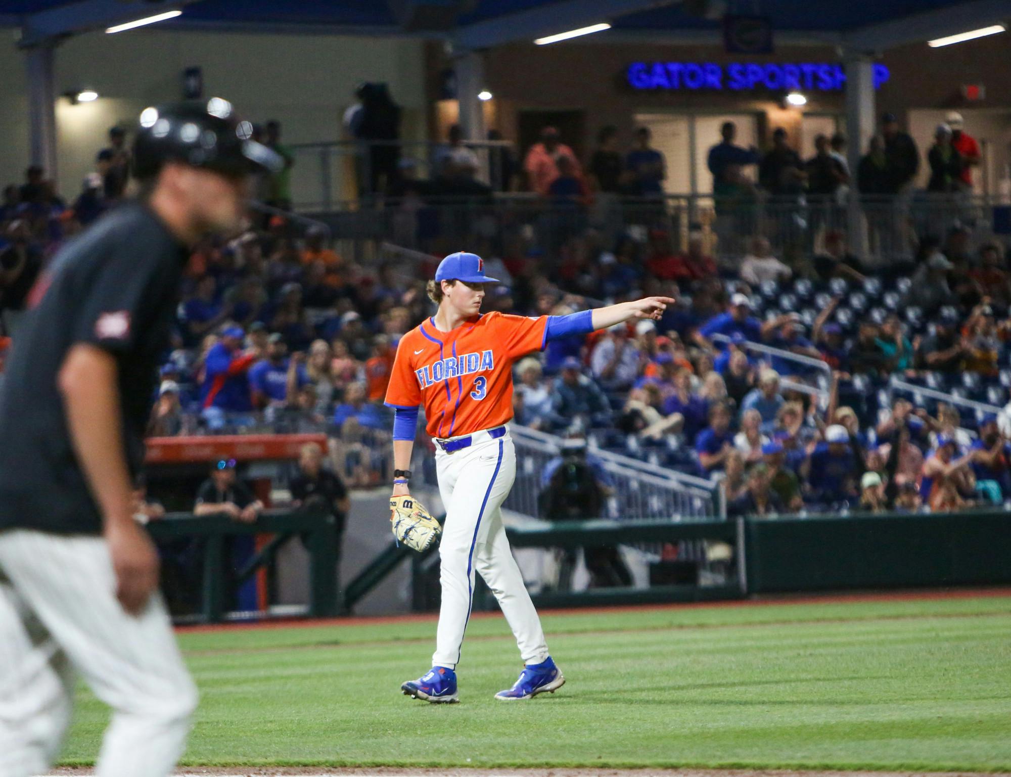 Florida pitcher Cade Fisher walks to the dugout during the Gators' 7-1 win over Texas Tech Sunday, June 4, 2023. 