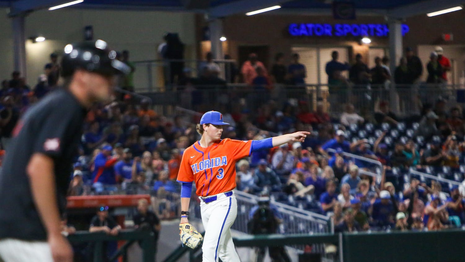 Florida pitcher Cade Fisher walks to the dugout during the Gators' 7-1 win over Texas Tech Sunday, June 4, 2023. 