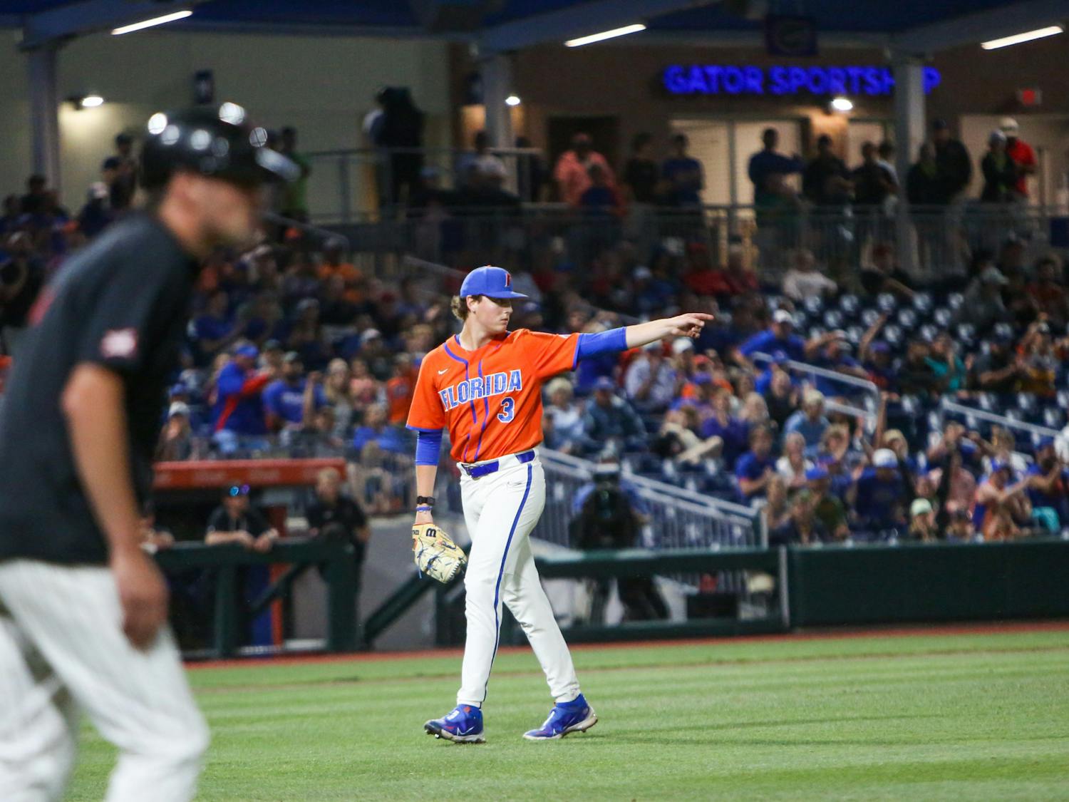 Florida pitcher Cade Fisher walks to the dugout during the Gators' 7-1 win over Texas Tech Sunday, June 4, 2023. 