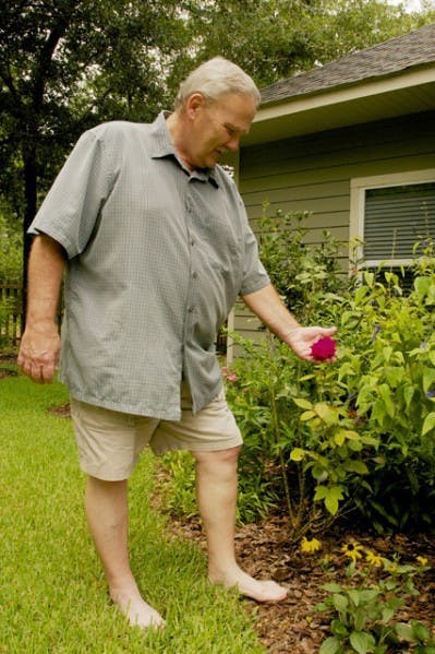 UF professor of entomology and nematology Carl Barfield relaxes in his backyard after a day of gardening Monday afternoon. Barfield will be retiring after 35 years of teaching.