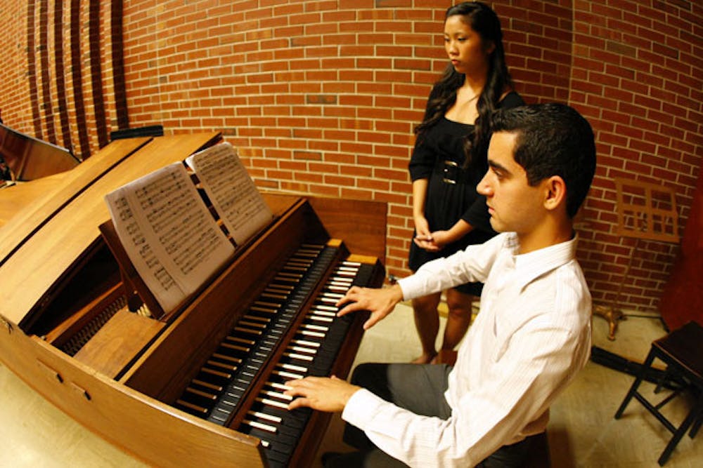 <p>Peter Orta plays "Sonata for Two Harpsichords in F Major" by Bach at the Harpsichord Ensemble studio recital Monday afternoon. Students demonstrated skills they learned during the first semester the harpsichord was taught at UF.</p>
