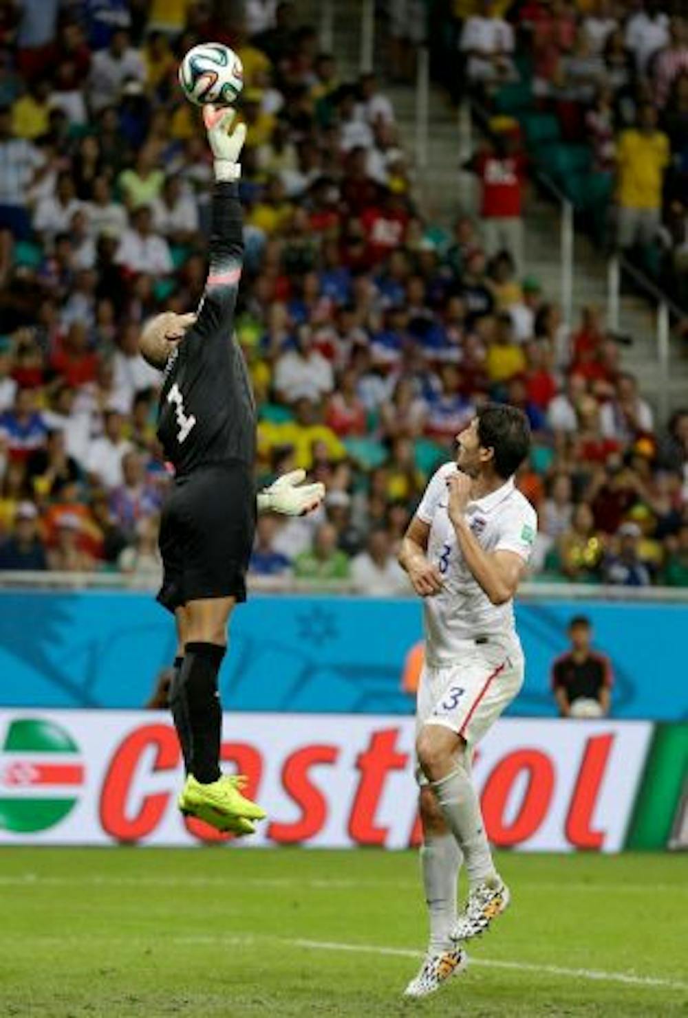 <p>United States’ goalkeeper Tim Howard leaps over Omar Gonzalez to tip the ball away during the U.S.’ 2-1 loss to Belgium on Tuesday.</p>