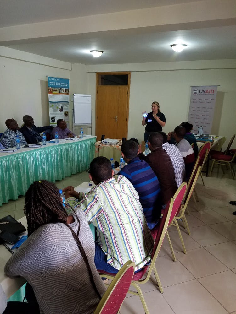 Taylor Langford teaches participants in Ethiopia how to properly wash their hands and how easily germs can spread using Glo Germ and a blacklight.