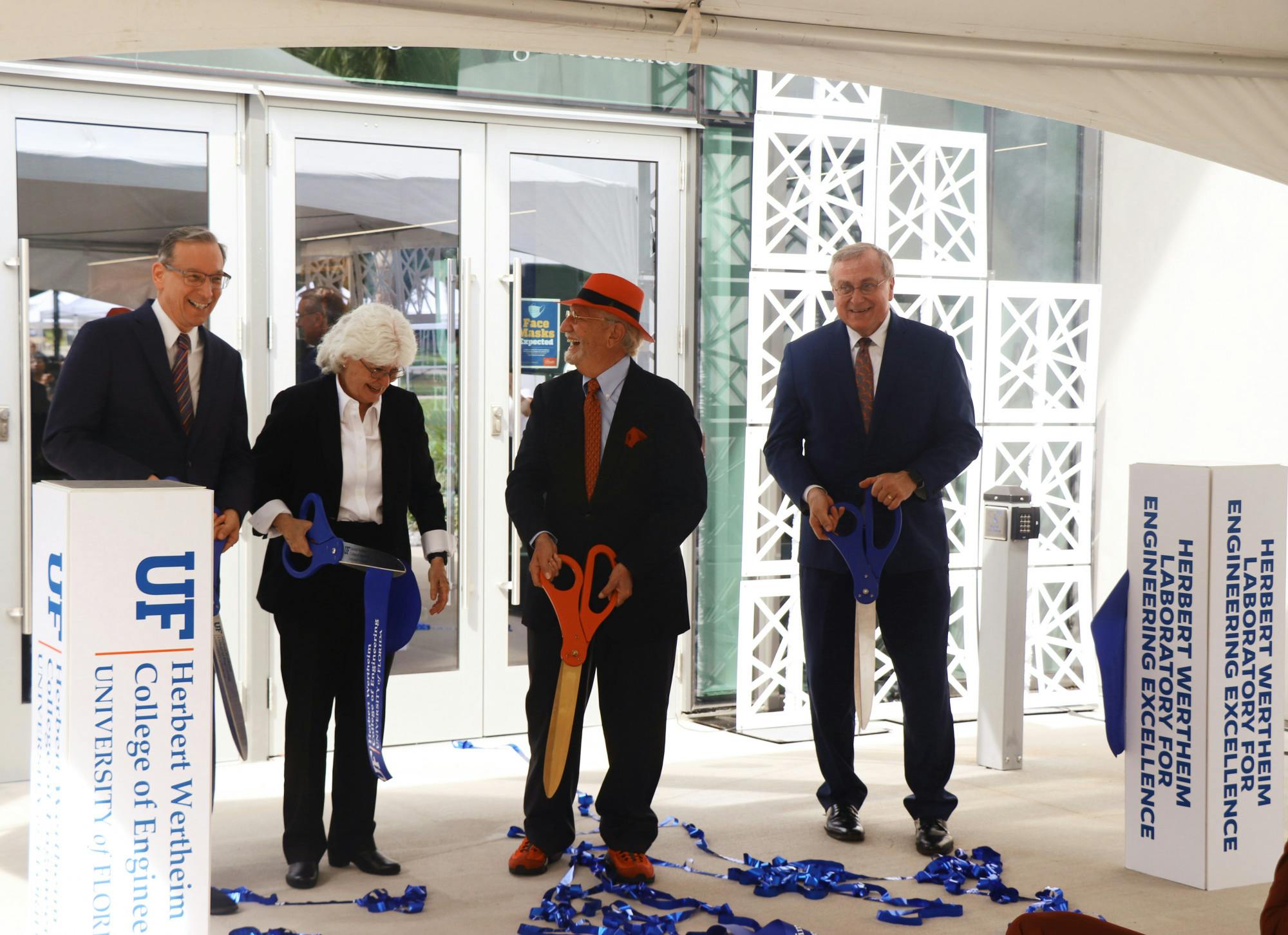 UF Provost Joseph Glover, Dean of the College of Engineering Cammy Abernathy, UF College of Engineering namesake Herbert Wertheim and UF President Kent Fuchs (left to right) are seen moments after cutting the ribbon at the Herbert Wertheim Laboratory for Engineering Excellence, Wertheim&#x27;s namesake, on Thursday, Oct. 7, 2021.