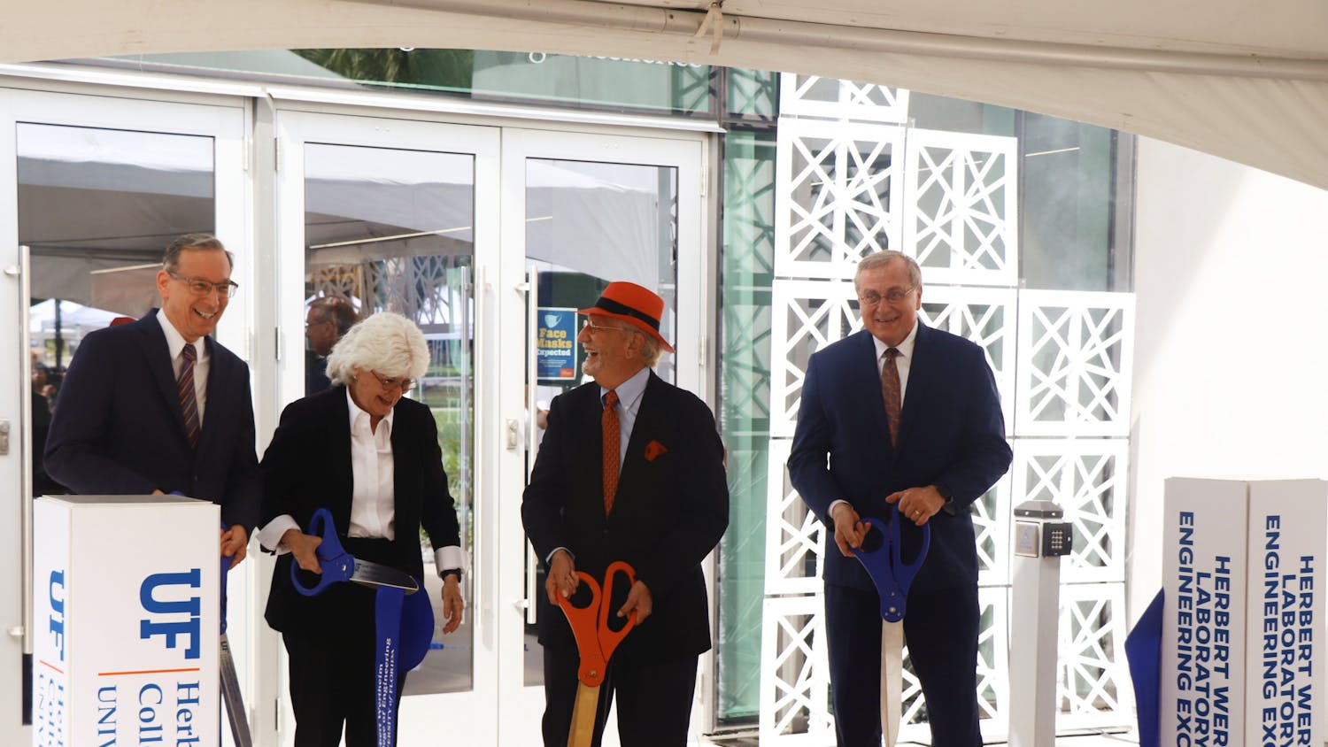 UF Provost Joseph Glover, Dean of the College of Engineering Cammy Abernathy, UF College of Engineering namesake Herbert Wertheim and UF President Kent Fuchs (left to right) are seen moments after cutting the ribbon at the Herbert Wertheim Laboratory for Engineering Excellence, Wertheim&#x27;s namesake, on Thursday, Oct. 7, 2021.