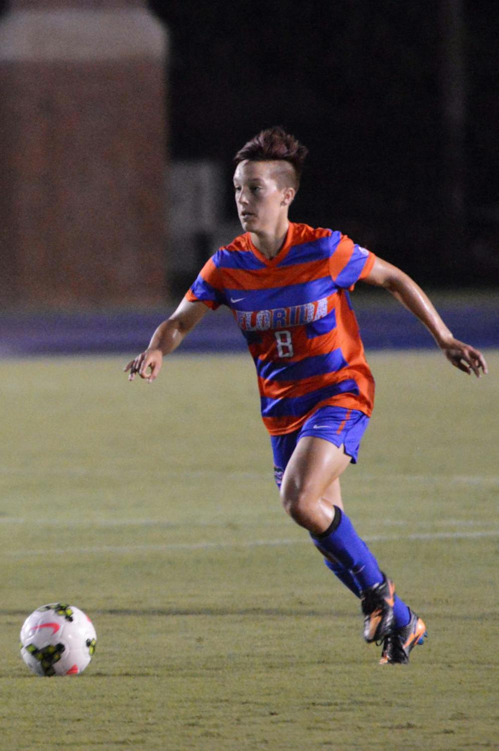 <p>Claire Falknor dribbles the ball during Florida's 3-0 win against Miami on Aug. 22 at James G. Pressly Stadium.</p>