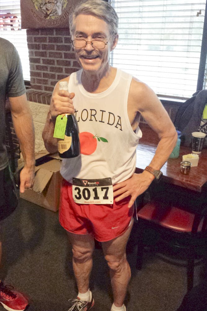 An accomplished runner who often dominated the competition in his age group, UF physics professor Steven Detweiler poses for a picture on New Year's Day after the Shorter Mile race in Gainesville,. Detweiler was 68 when he passed away.