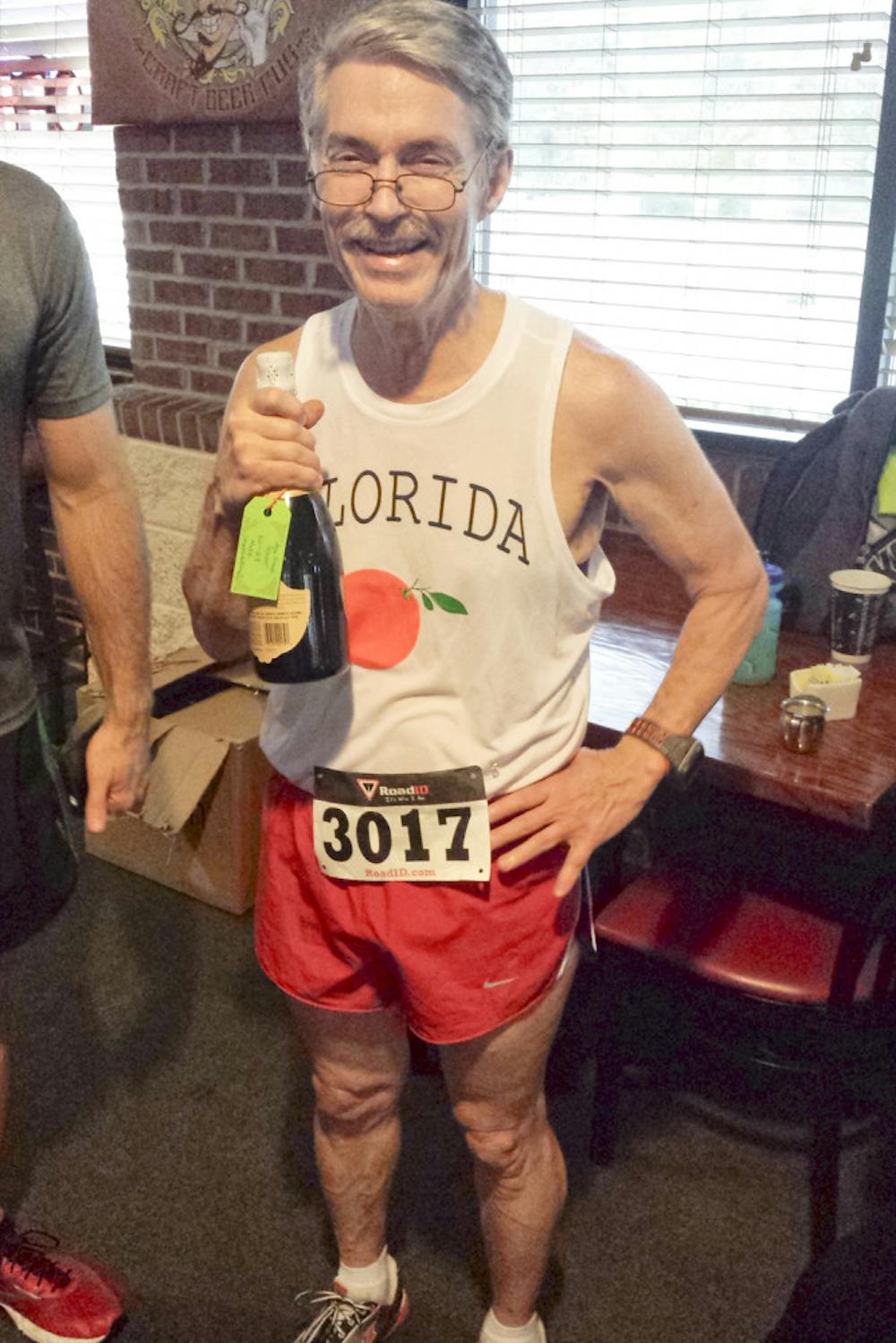 <p>An accomplished runner who often dominated the competition in his age group, UF physics professor Steven Detweiler poses for a picture on New Year's Day after the Shorter Mile race in Gainesville,. Detweiler was 68 when he passed away.</p>