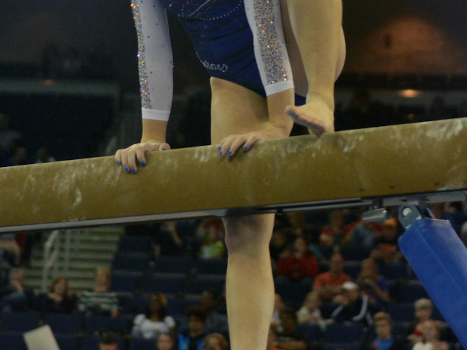Freshman Ericha Fassbender steps back onto the balance beam after falling during the Southeastern Conference Championships on March 21 in Duluth, Georgia.