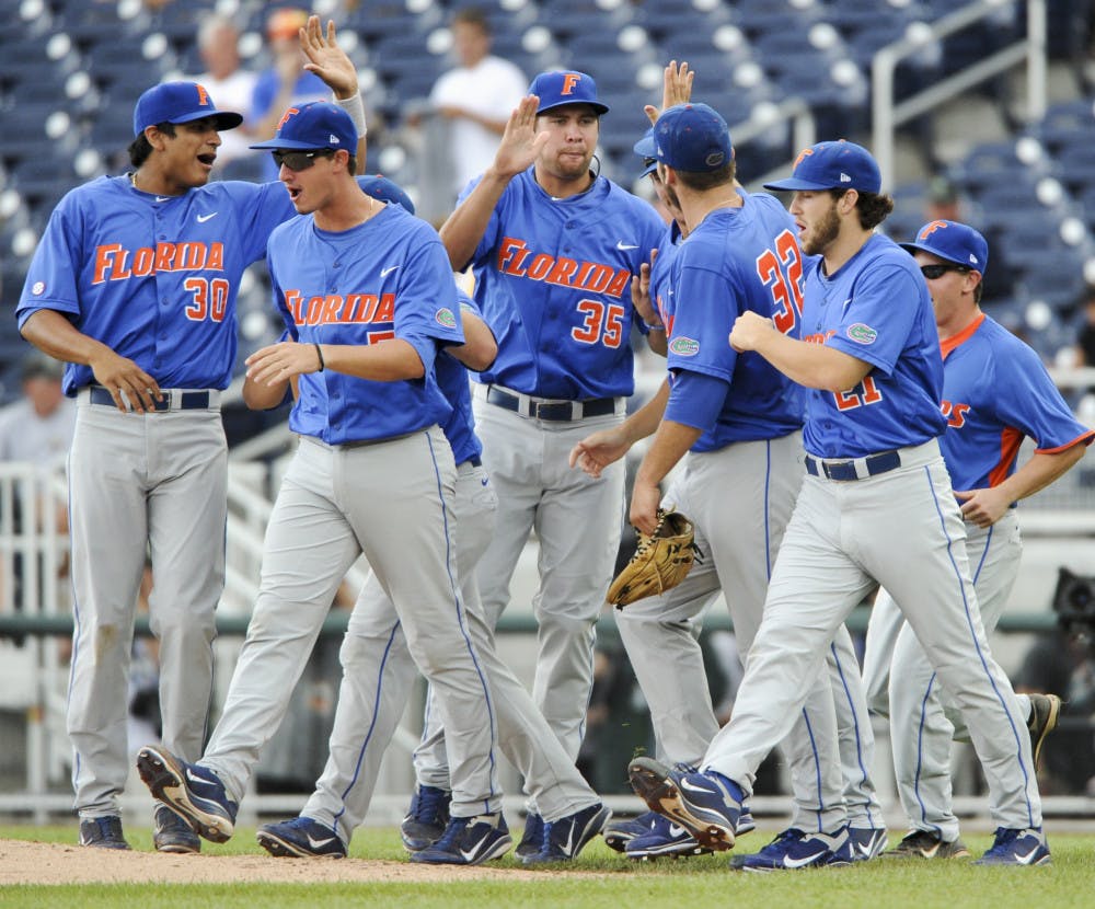 Florida celebrates after beating Vanderbilt 3-1 in a weather-delayed College World Series contest. The Gators dropped their SEC foes for the fourth time in five tries.