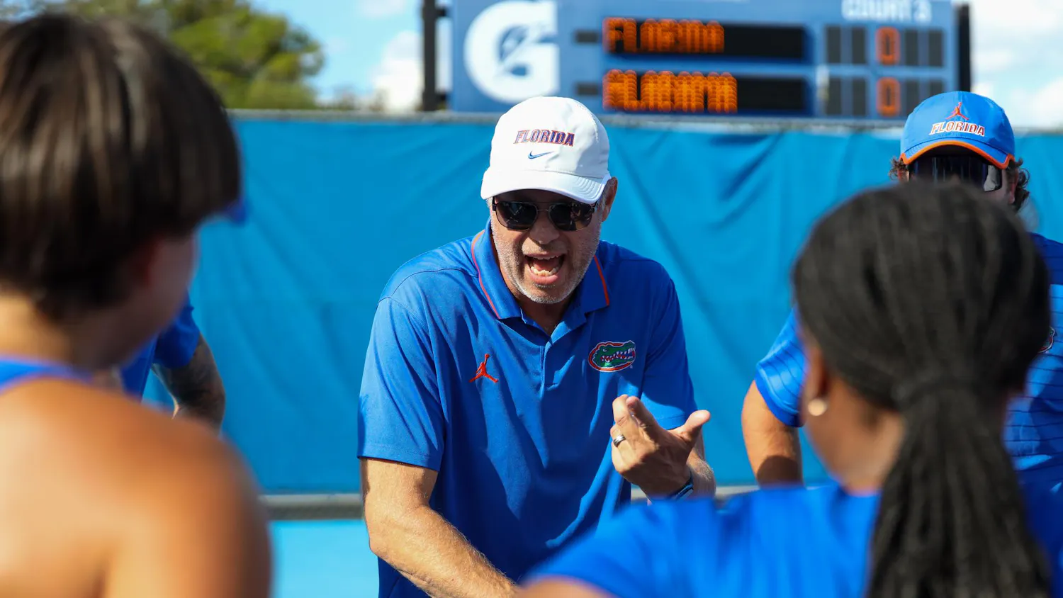 UF women's tennis head coach, Per Nilsson, speaks to his team in a huddle before their matchup against Alabama on Thursday, March 26, 2026 in Gainesville, Fla.