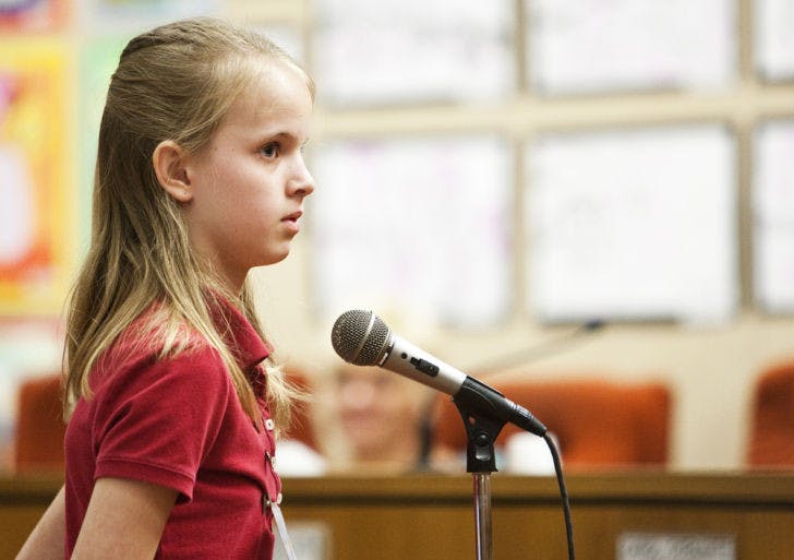 Seventh-grader Emma Porter, 12, spells the winning word during the 23rd round of the 2013 Alachua County Public Schools District Spelling Bee.