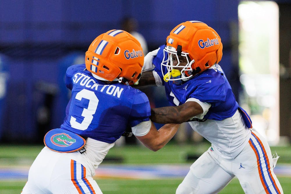 Florida Gators wide reciever Bailey Stockton and Florida Gators wide reciever Vernell Brown III take part in a blocking drill during a spring practice, Thursday, April 2, 2026, in Gainesville, Fla.