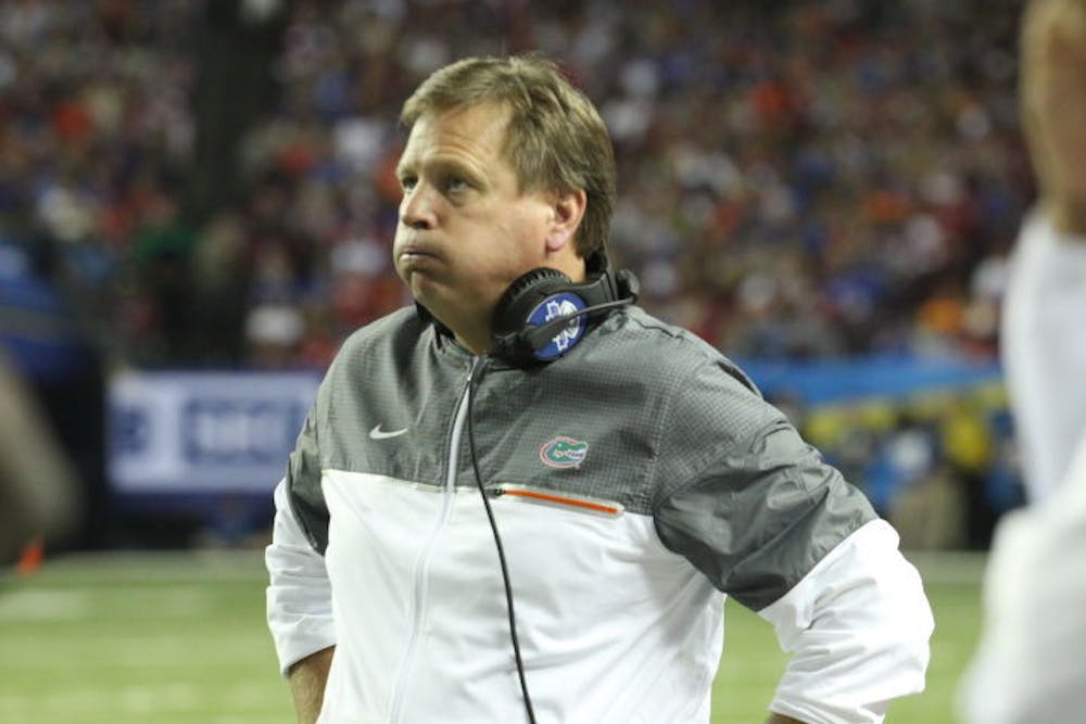<p>Jim McElwain looks on during Florida's 54-16 loss to Alabama in the SEC Championship Game on Dec. 3, 2016, in Atlanta.</p>