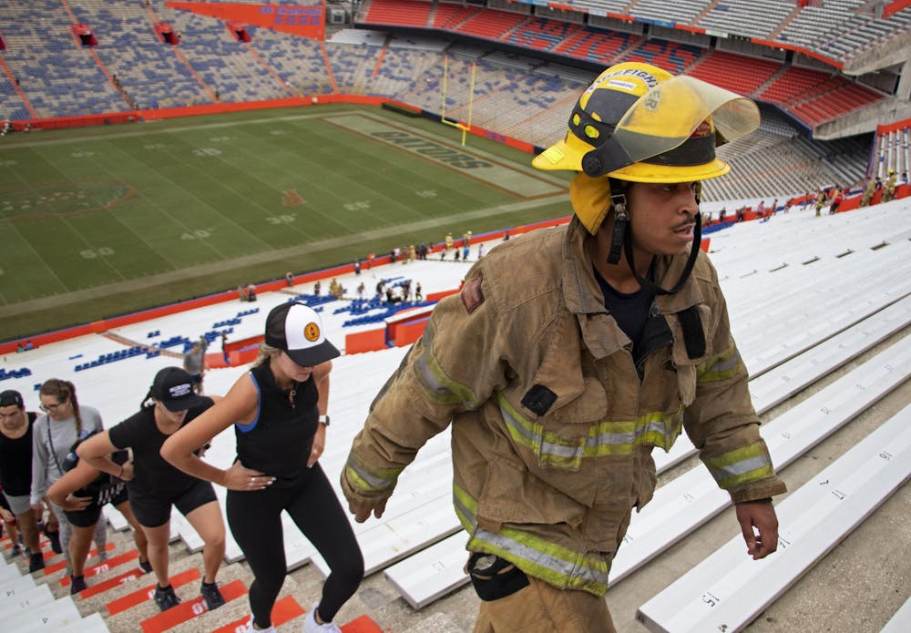 Anthony “Hutch” Hutchinson, Gainesville Fire Rescue first responder, marches up the stadium steps during the 5th Annual UF Collegiate Veterans Society 9/11 Memorial Stair Climb at Ben Hill Griffin Stadium on Saturday, Sept. 11, 2021.