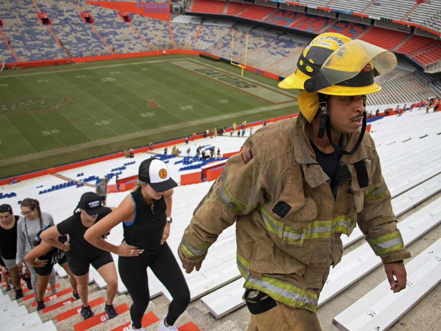 Anthony “Hutch” Hutchinson, Gainesville Fire Rescue first responder, marches up the stadium steps during the 5th Annual UF Collegiate Veterans Society 9/11 Memorial Stair Climb at Ben Hill Griffin Stadium on Saturday, Sept. 11, 2021.