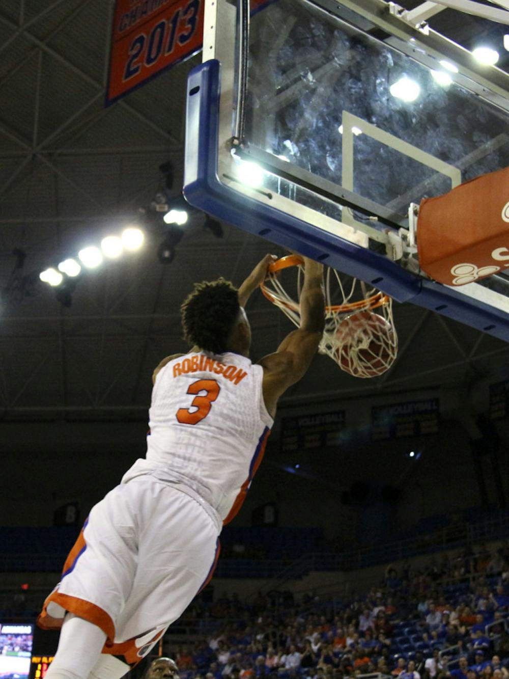 <p>Devin Robinson dunks during Florida's 87-83 win over Arkansas on Feb. 3, 2016, in the O'Connell Center.</p>