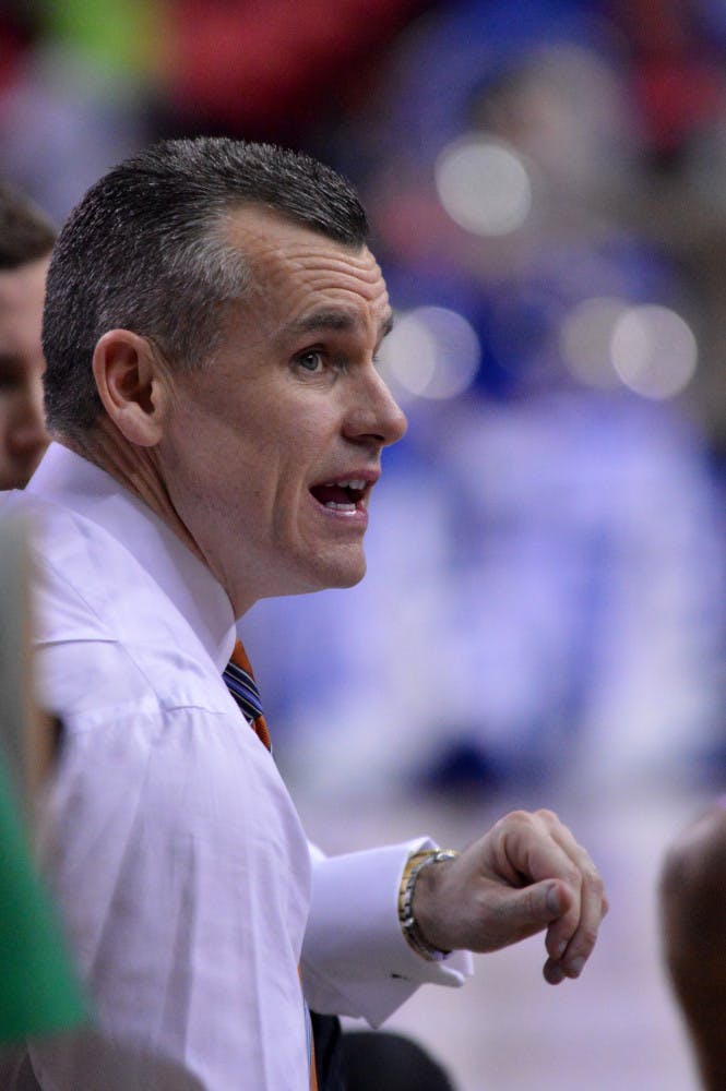 Billy Donovan talks to his players during a timeout in Florida’s 61-60 win against Kentucky on March 16 in the Georgia Dome in Atlanta.