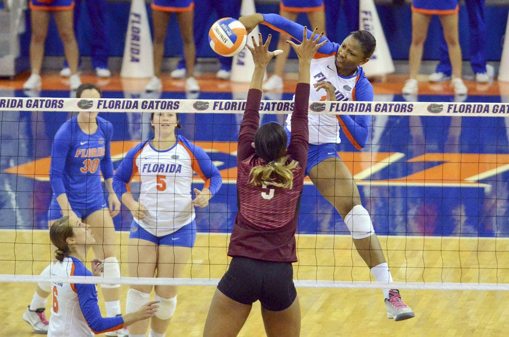 <p dir="ltr" align="justify">Middle blocker Rhamat Alhassan swings for a kill during Florida's 3-0 win against Mississippi State on Oct. 26, 2014,&nbsp;in the O'Connell Center.</p>