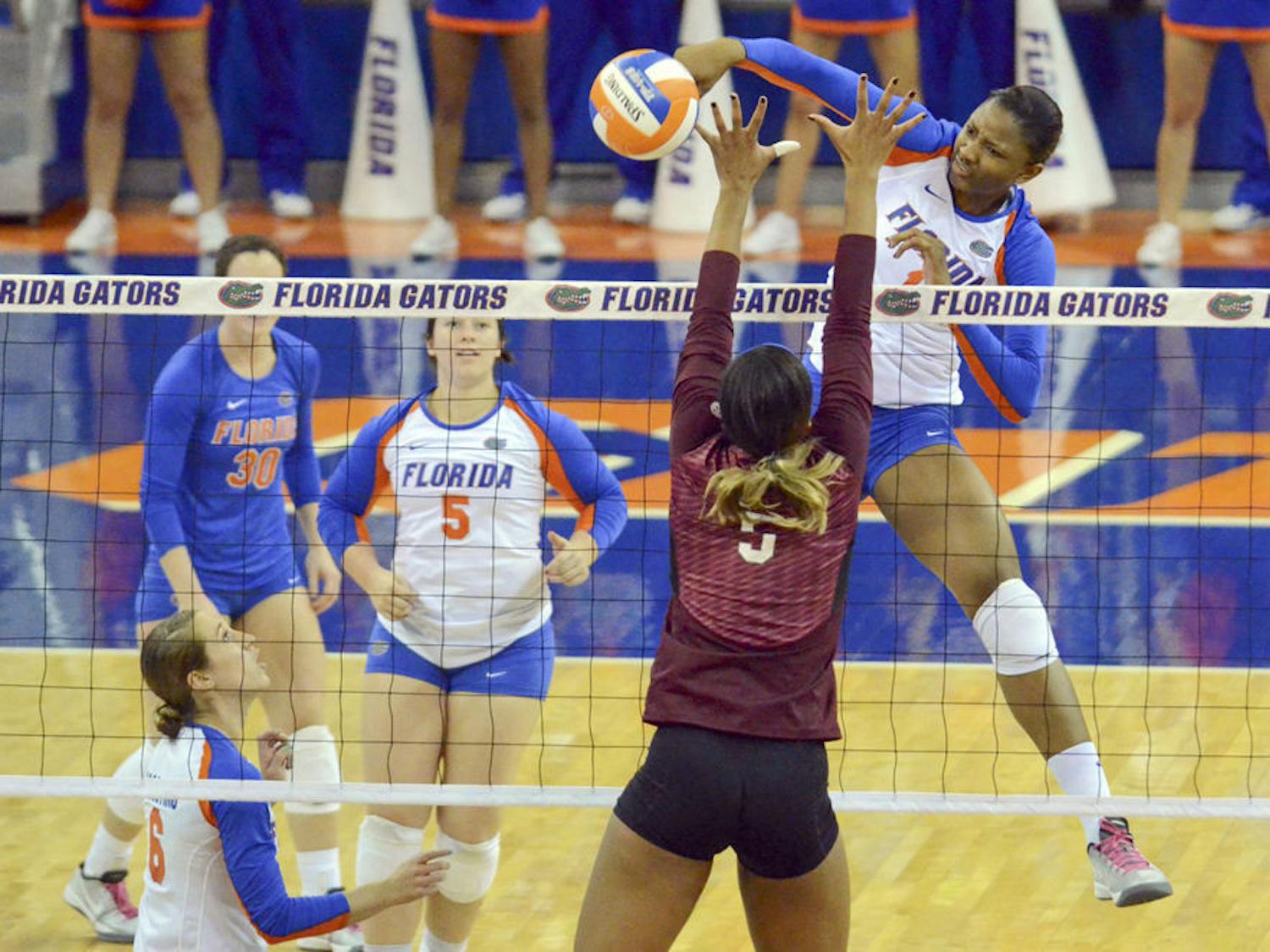 Middle blocker Rhamat Alhassan swings for a kill during Florida's 3-0 win against Mississippi State on Oct. 26, 2014,&nbsp;in the O'Connell Center.