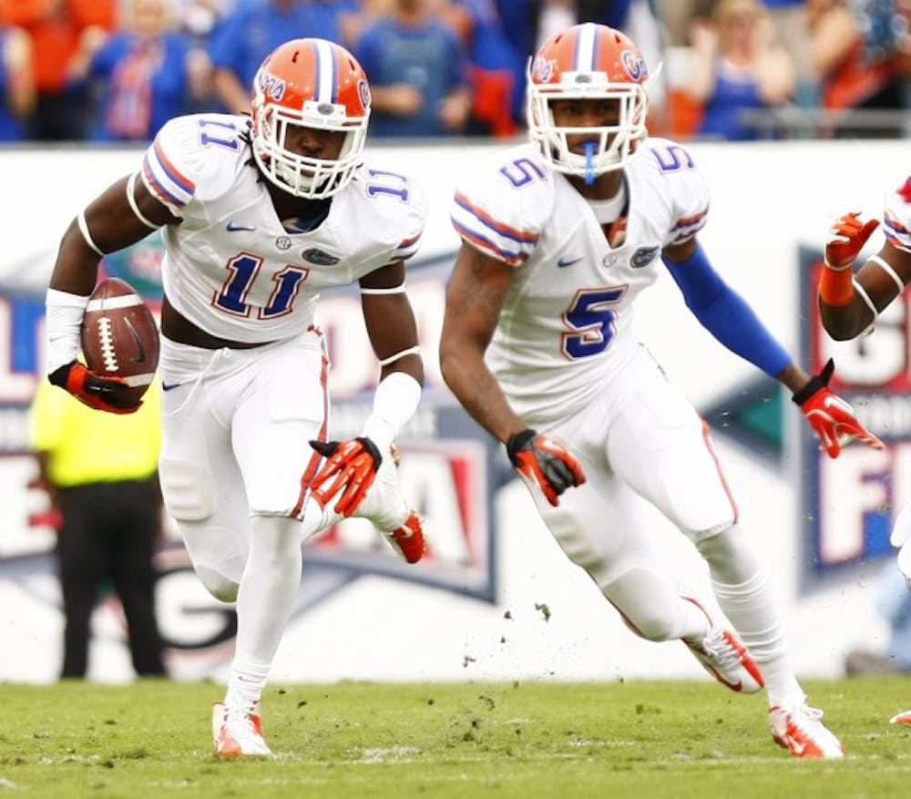 <p>Linebacker Neiron Ball (11) returns an interception thrown by Georgia’s Aaron Murray during the first quarter of UF’s 17-9 loss on Saturday at EverBank Field.</p>