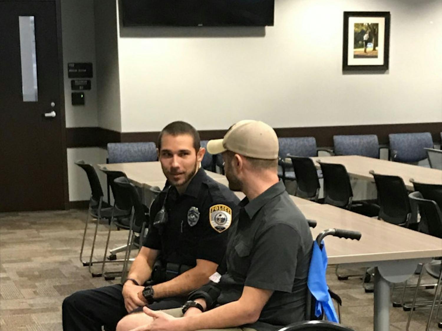 Joshua Roe, a 36-year-old UF doctoral student, and Gainesville Police officer Jack Salafrio meet on Thursday for the first time after Salafrio responded to a crash on Jan. 6 and rescued Roe. Roe was run over by his own car, which was stolen, police said.
&nbsp;