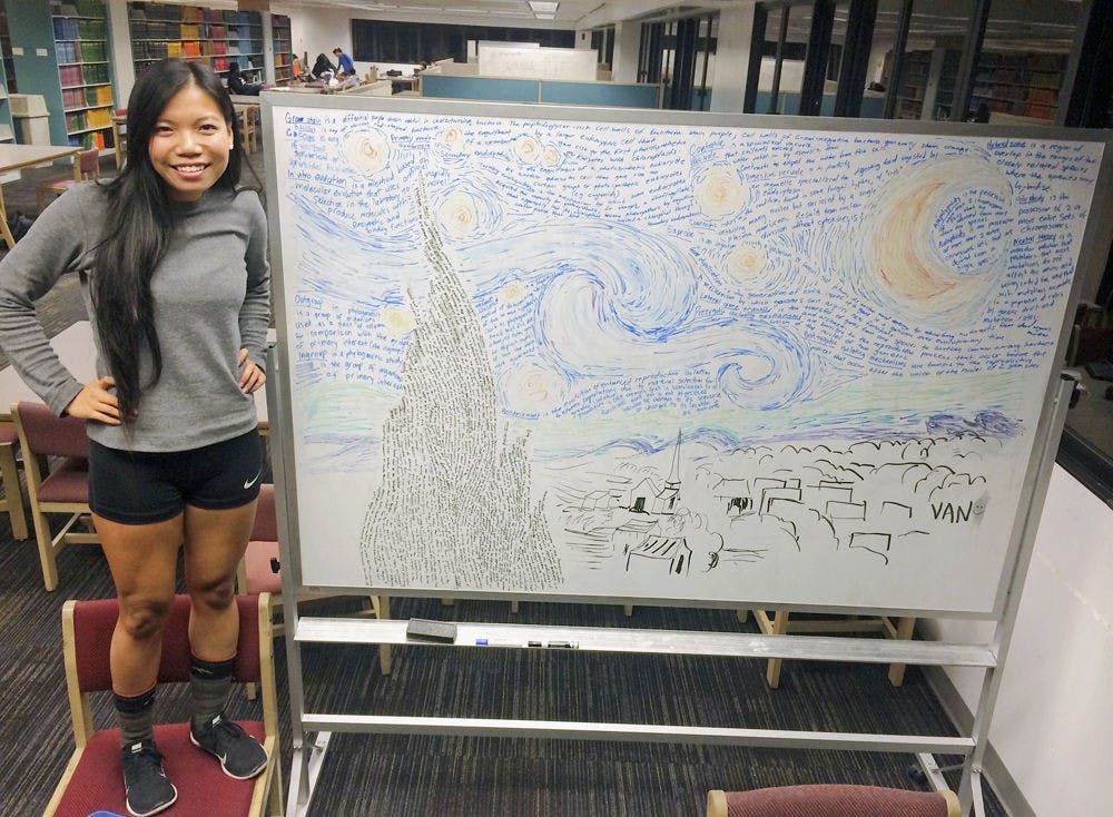 <p class="p1"><span class="s1">Van Truong, a 19-year-old anthropology sophomore, poses next to the “Starry Night” art piece she made on a whiteboard with her biology notes. Truong is applying for a grant within the Bob Graham Center for Public Service to bring the arts and sciences together.</span></p>