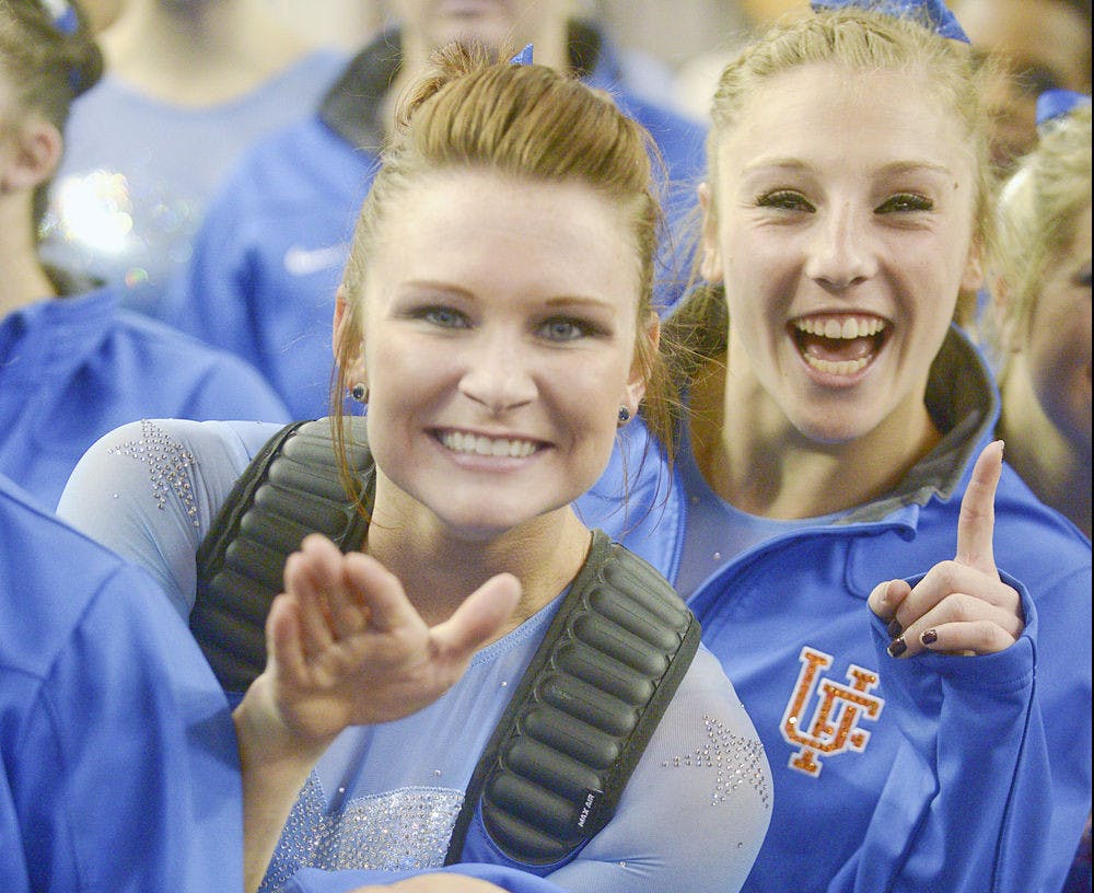 <p>Florida junior all-arounder Bridget Sloan and freshman all-arounder Alex McMurtry celebrate after competeing on vault during the 2015 NCAA gymnastics championships on Saturday in Fort Worth, Texas.</p>