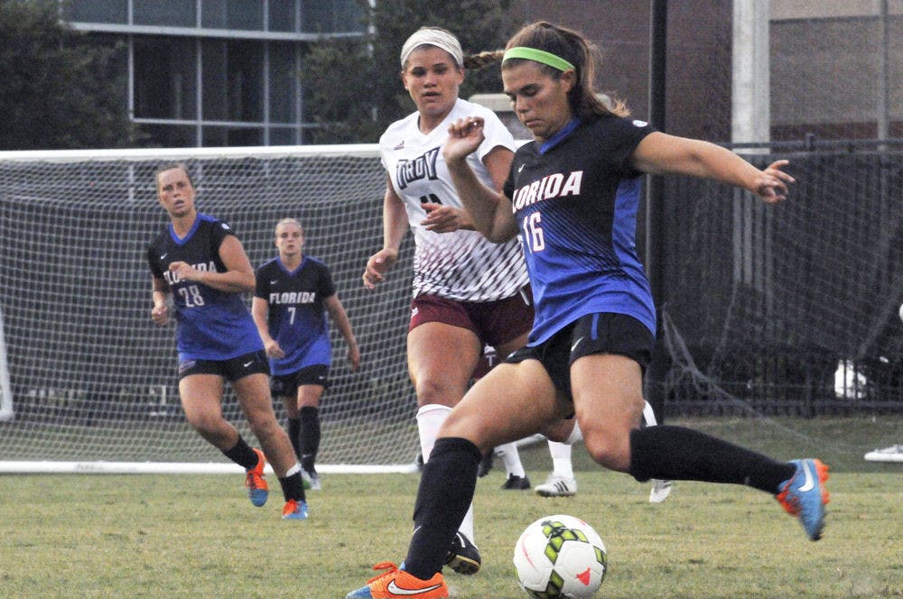 <p>UF midfielder Liz Slattery dribbles during Florida's 2-1 win against Troy in an exhibition match on Aug. 11, 2015, at the soccer practice field at Donald R. Dizney Stadium.</p>
