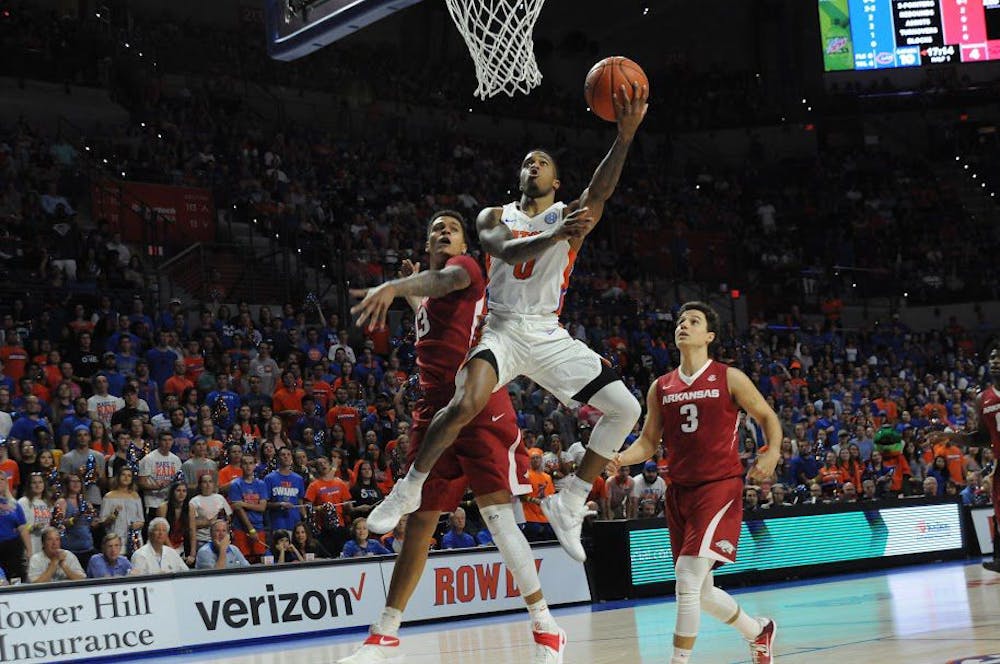 <p>UF guard Kasey Hill attempts a lay-up during Florida's 78-65 win against Arkansas on March 1, 2017, in the O'Connell Center.&nbsp;</p>