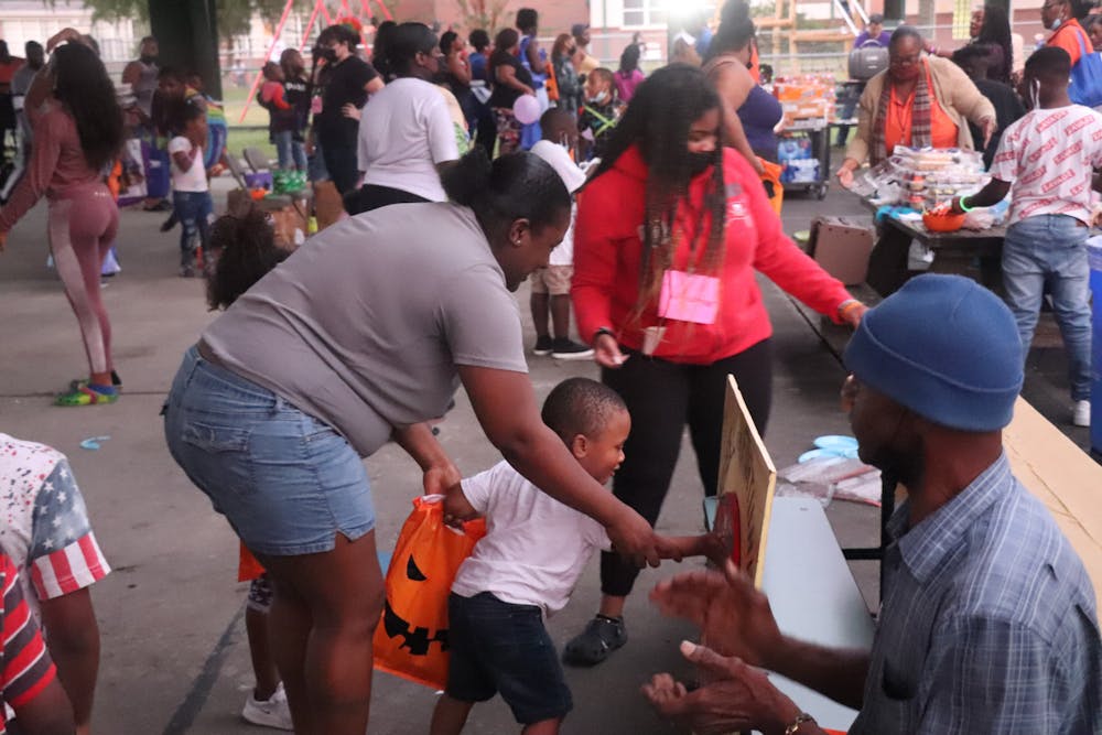 <p>Kids play games during Youth Night and Community Fall Festival at Duval Early Learning Academy on Thursday, Oct. 28, 2021. The festival was meant to bring children together with rising gun violence among youth.</p>