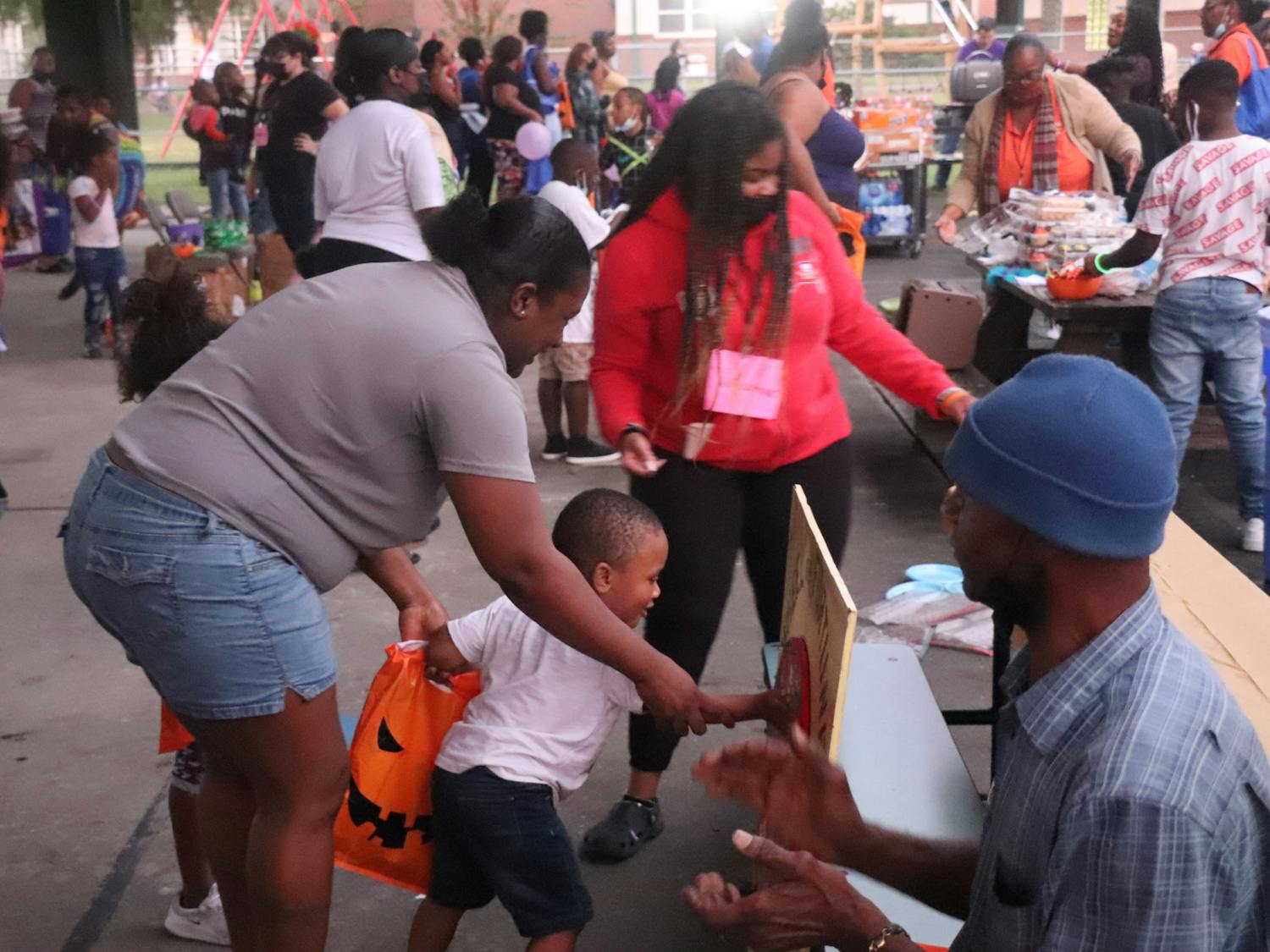 Kids play games during Youth Night and Community Fall Festival at Duval Early Learning Academy on Thursday, Oct. 28, 2021. The festival was meant to bring children together with rising gun violence among youth.