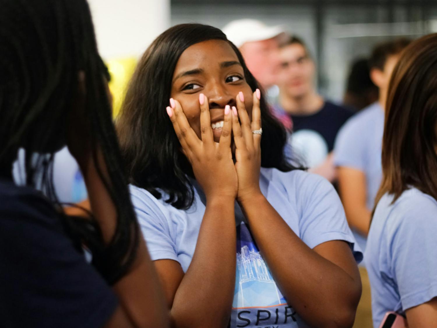 Daziah Scurry, a 19-year-old UF sophomore studying political science and telecommunications, anxiously listens to the long list of Inspire party losses in the Reitz Union on Wednesday night.
