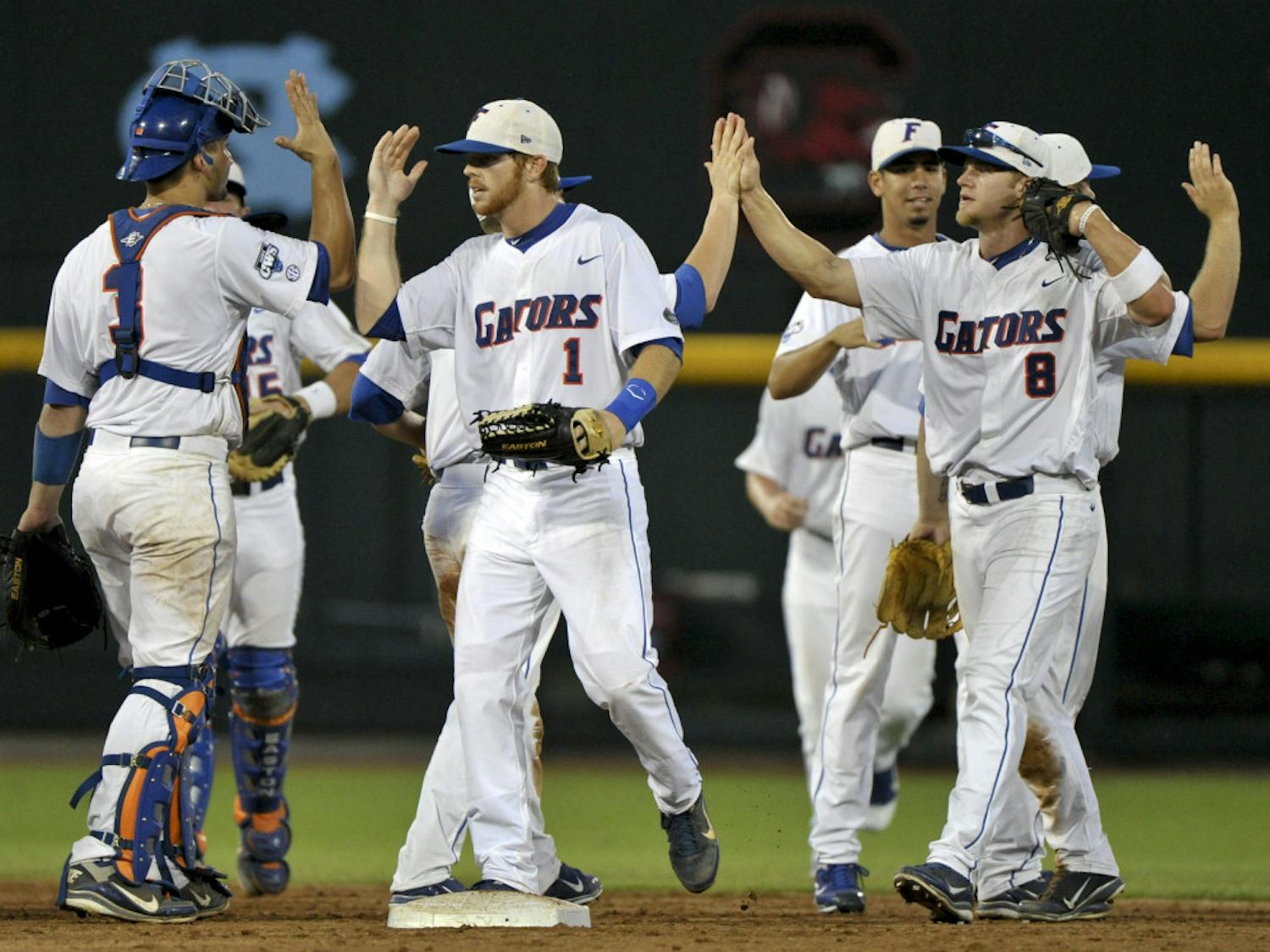 Bryson Smith, (1) pictured center, reached base in all five plate appearances in Florida's 8-4 win over Texas Saturday at the NCAA College World Series in Omaha, Neb. Smith met with reporters afterwards for the first time since his embarrassing arrest in mid-March.