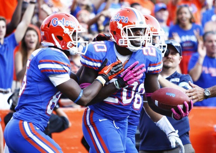 Omarius Hines (20) celebrates after making a one-handed touchdown catch that was called back in UF’s 44-11 win against South Carolina on Saturday.
