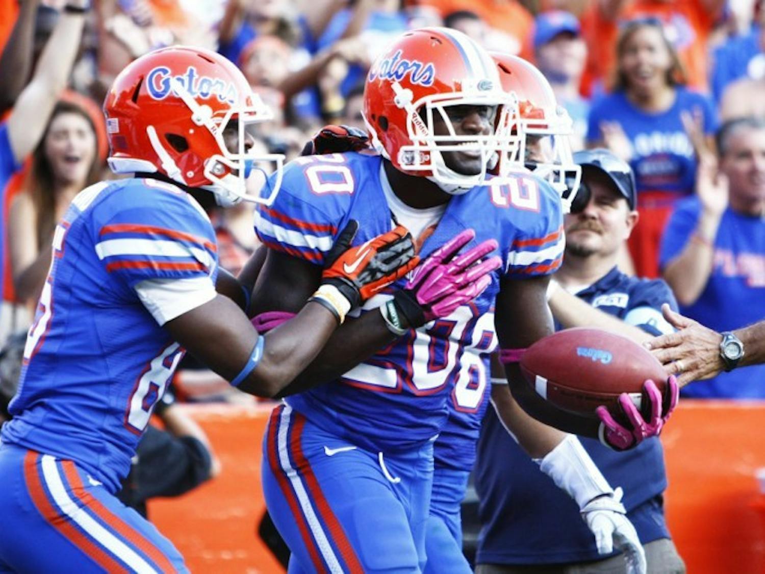Omarius Hines (20) celebrates after making a one-handed touchdown catch that was called back in UF’s 44-11 win against South Carolina on Saturday.
