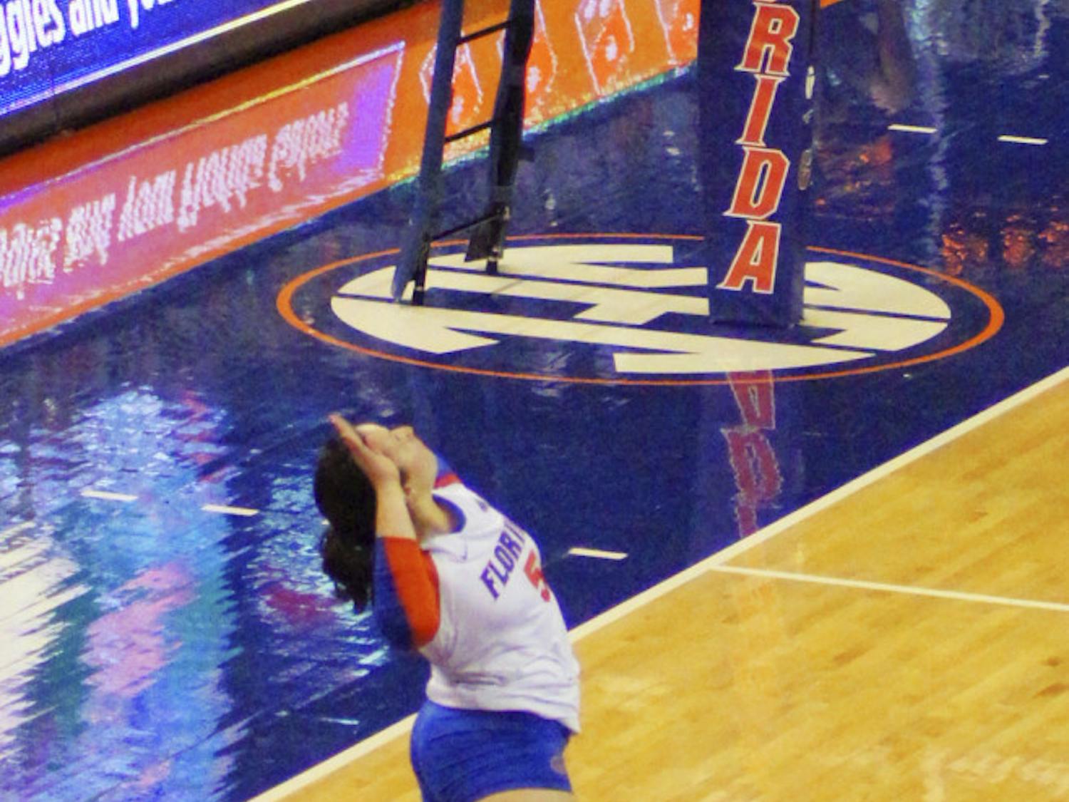 Taylor Unroe jumps to serve during Florida's 3-0 win against Texas A&M on Sunday in the O'Connell Center.