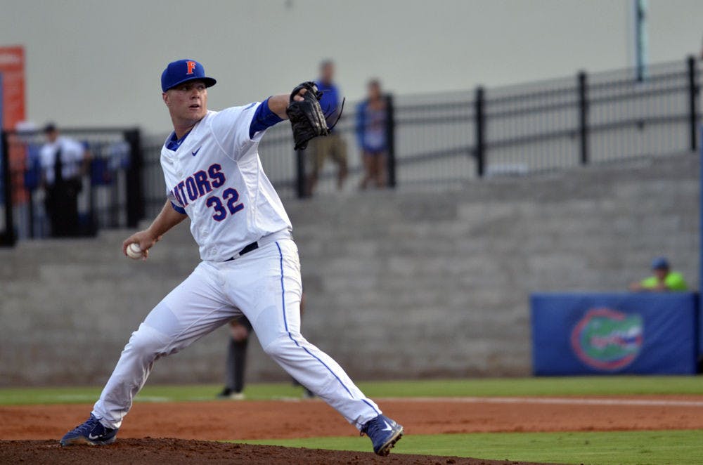 UF’s Logan Shore pitches during Florida’s 14-3 win against South Carolina on April 10, 2015, at McKethan Satdium.