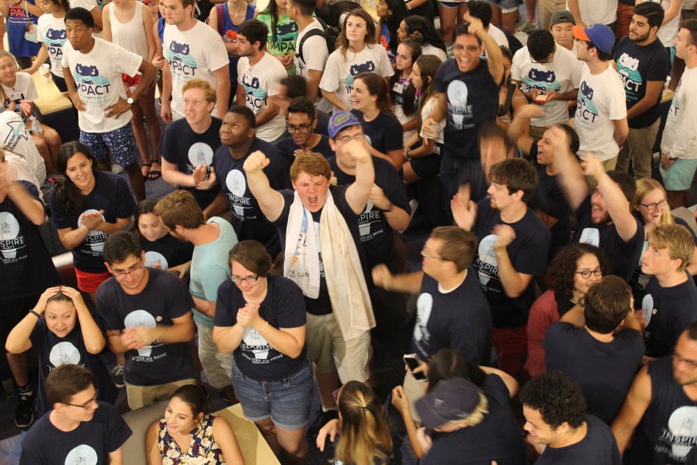 <p><span>Inspire Party members cheer as Student Government election results are announced Wednesday night. Inspire won 20 seats, while Impact took 29.</span></p>