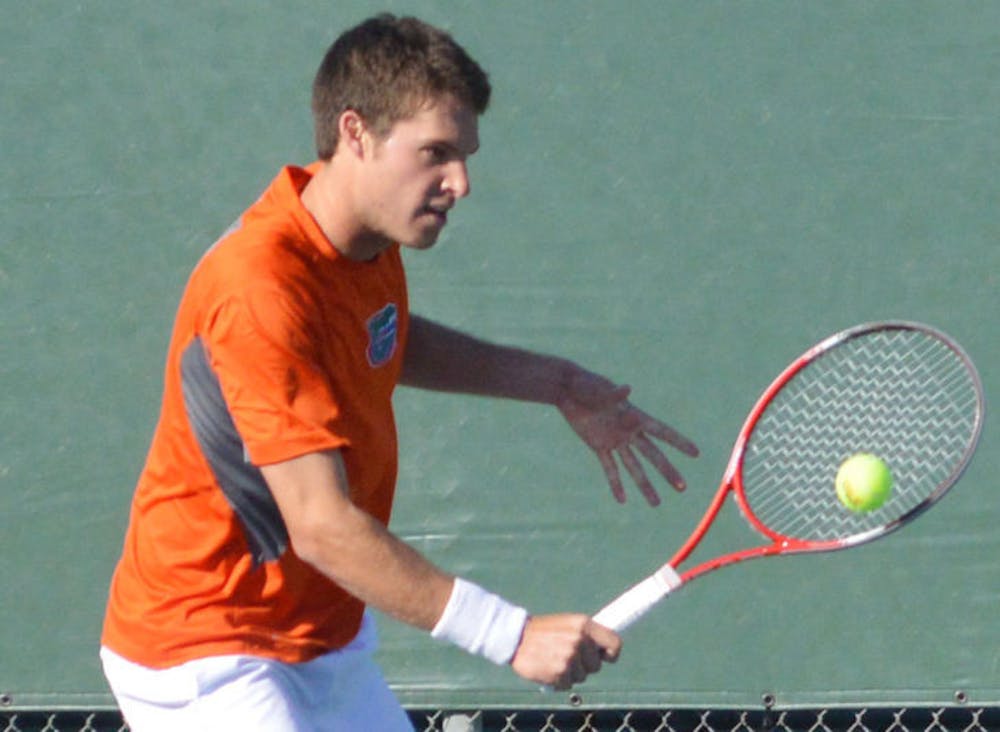 <p>Mike Alford returns a ball during Florida’s 4-2 win against North Florida on Jan. 22 at the Ring Tennis Complex.</p>