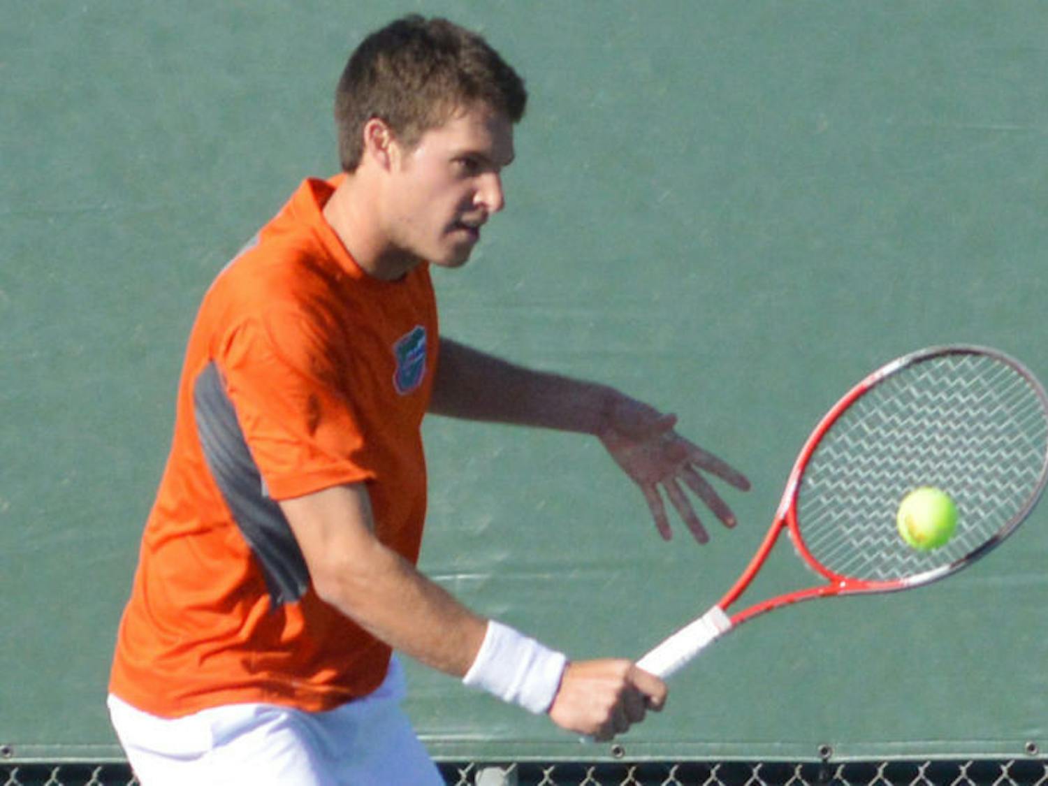 Mike Alford returns a ball during Florida’s 4-2 win against North Florida on Jan. 22 at the Ring Tennis Complex.