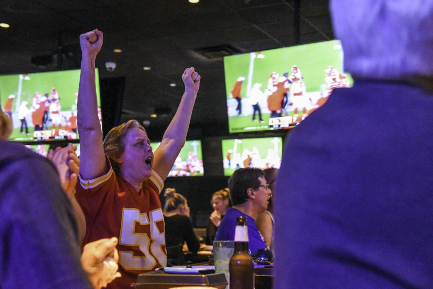 Football fans gather at the Miller's Ale House on 2881 Bass Pro Shops Blvd to watch the 2020 Super Bowl game Sunday evening. 