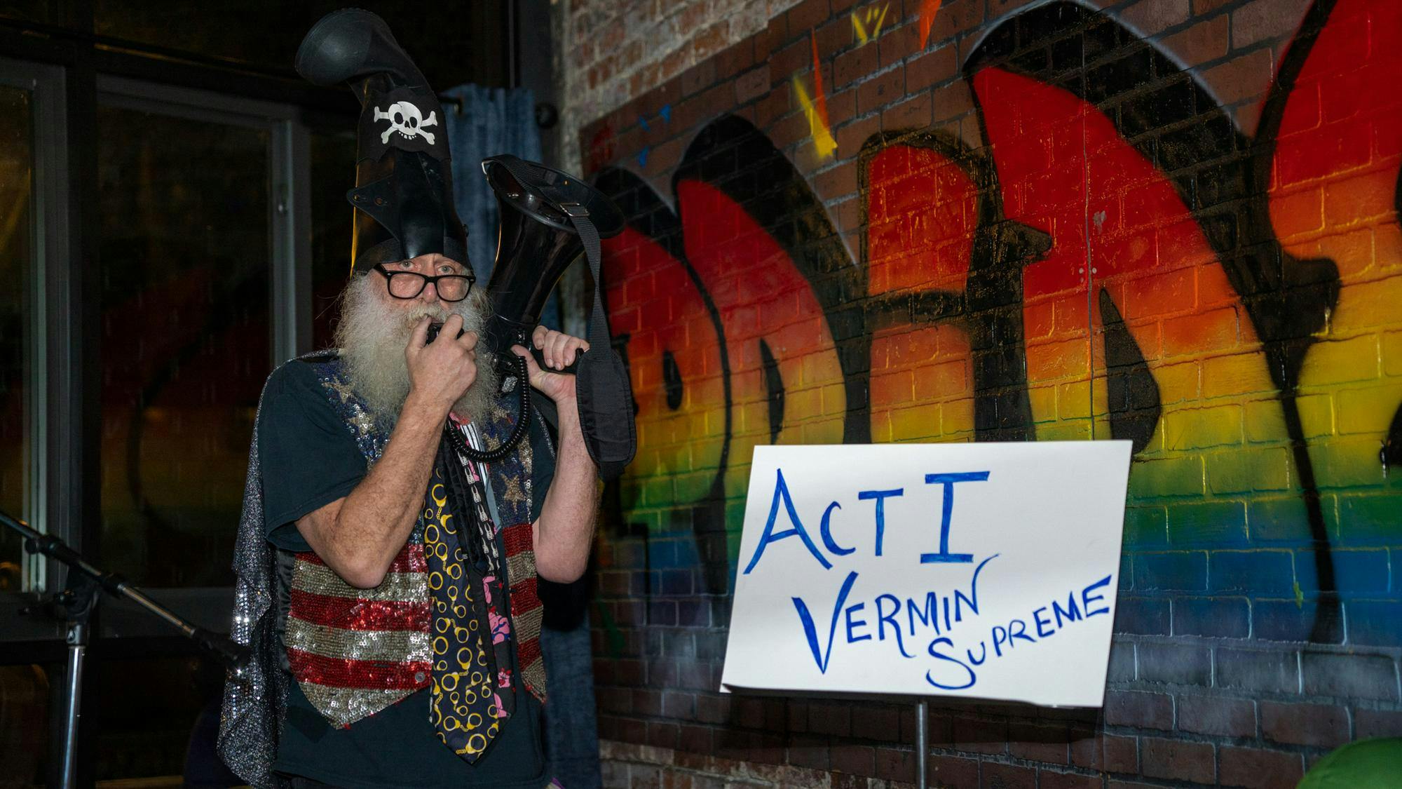 Vermin Supreme addresses the audience with a megaphone at University Club, Monday, Jan. 5, 2026.