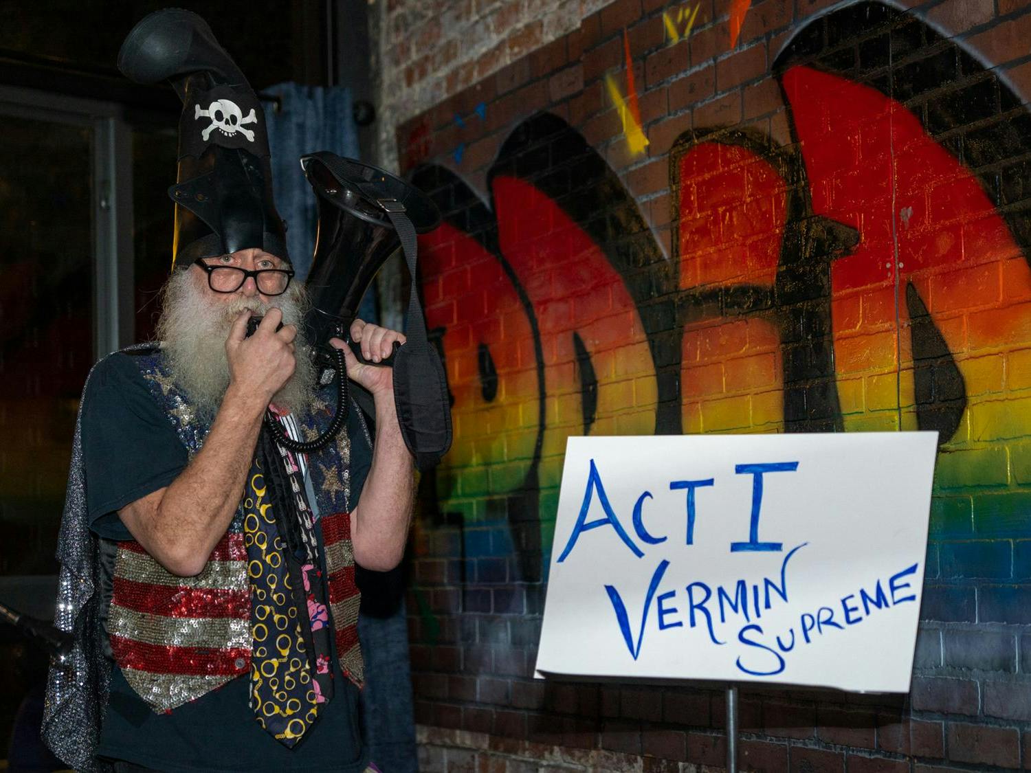Vermin Supreme addresses the audience with a megaphone at University Club, Monday, Jan. 5, 2026.