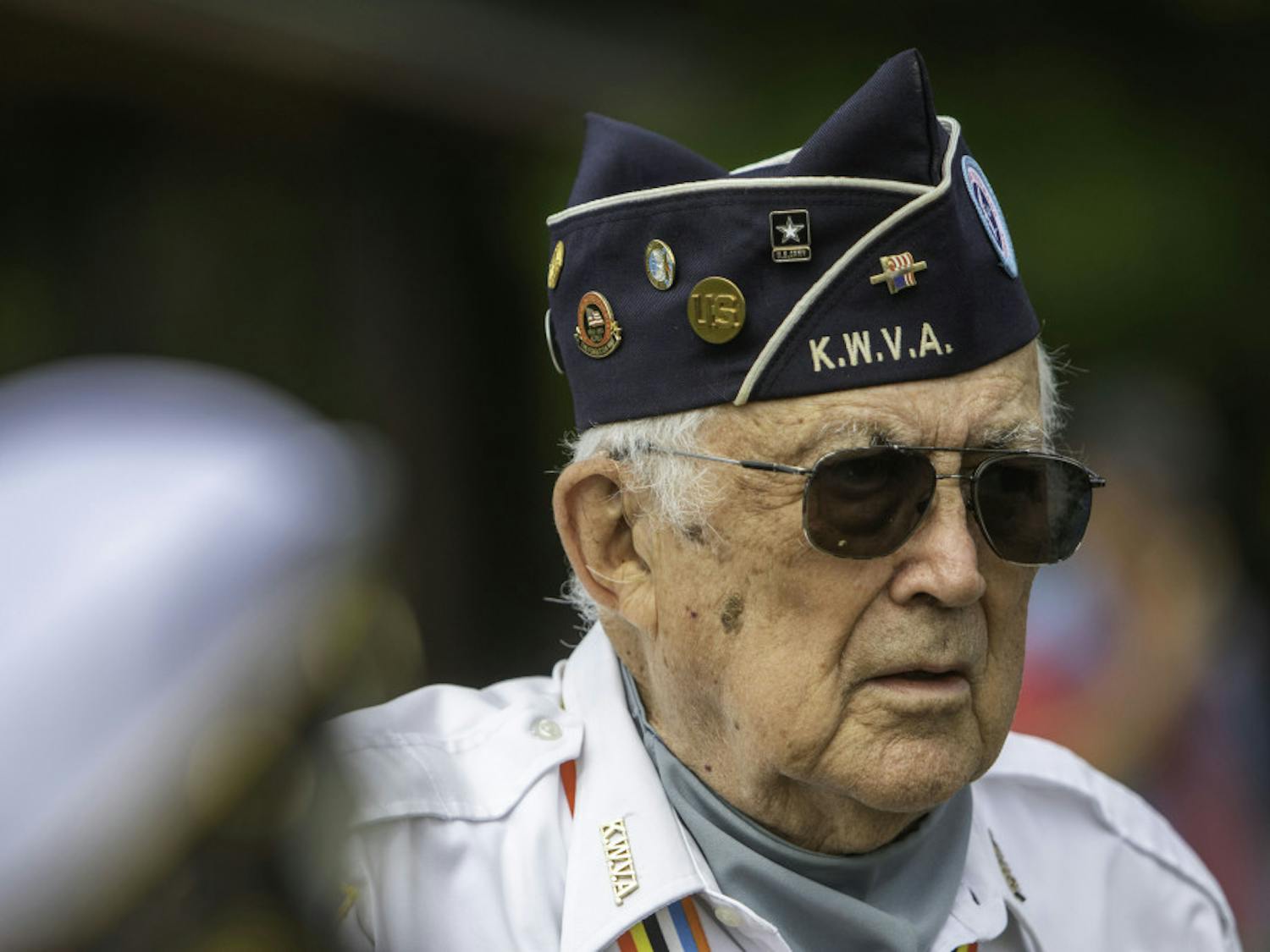Kenneth Sassaman, an 86-year-old Korean War veteran and Gainesville resident, listens to a speaker Saturday at the Vietnam Veterans Tribute event at Veterans Memorial Park, 7400 SW 41st Place. Sassaman served in the U.S. Army in the 25th division and 27th regiment, which was known as the “Wolfhounds.” “When these Vietnam veterans came home, they were treated like dirt,” he said. “Their recognition for them is fantastic. They deserve it. More than deserve it.”