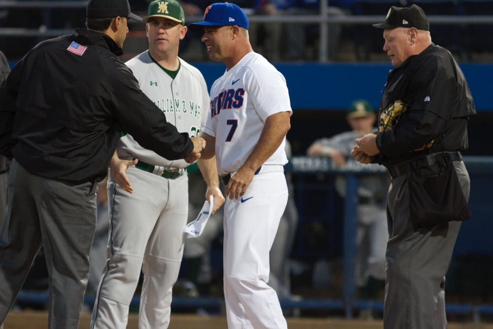 Kevin O’Sullivan meets with umpires before Florida’s 5-4 win against William &amp; Mary on Feb. 17, 2017, at McKethan Stadium.